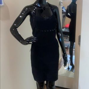 Bandage dress with pyramid embellishments.